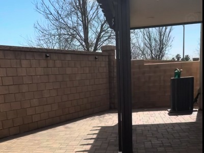 Paver patio extending toward the existing covered patio in a Fontana, CA backyard